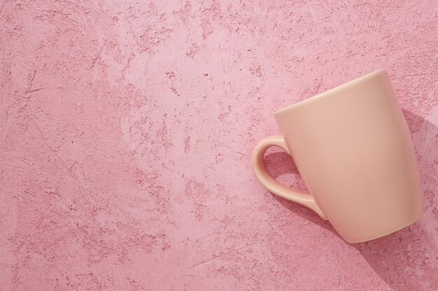 A beautiful cup on a pink background