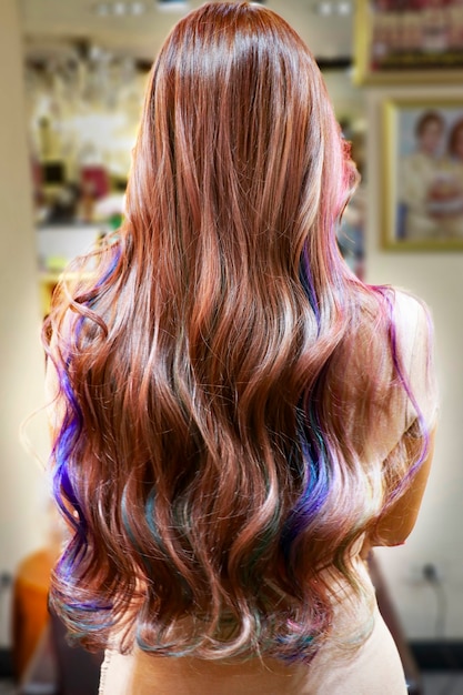 Beautiful curly hair after dyed with many colors and curled in professional salon