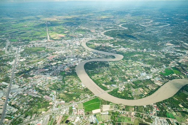 Beautiful Curve River was shot on the plane in the noon. It can see farming and valley all around.