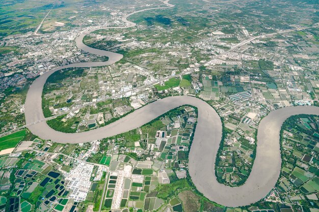 Beautiful Curve River was shot on the plane in the noon. It can see farming and valley all around.