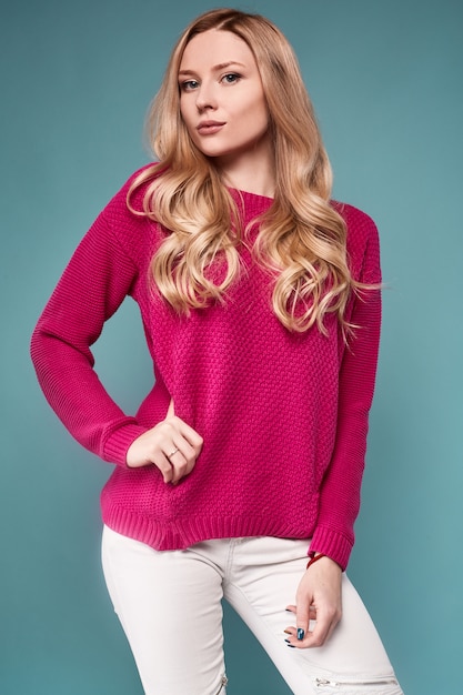 Beautiful cute blond woman in purple sweater