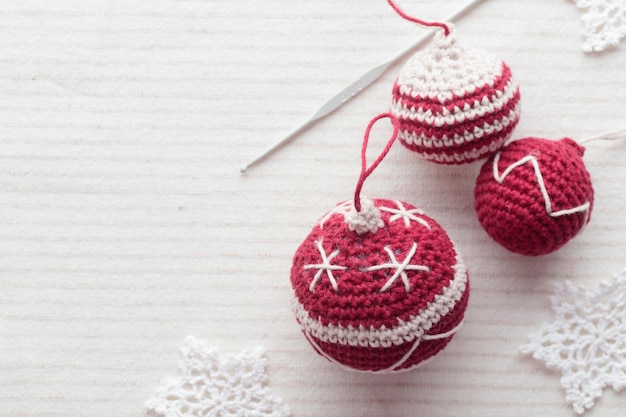 Beautiful cute crocheted christmas balls for decoration Horizontal Banner with copyspace