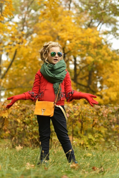 Beautiful cute girl on a day walk in the park