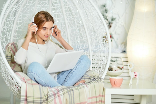 Beautiful cute girl using laptop