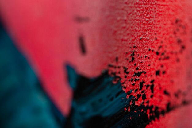 Photo beautiful dark colorful background with blue and pink oil paint ink macro colored art texture