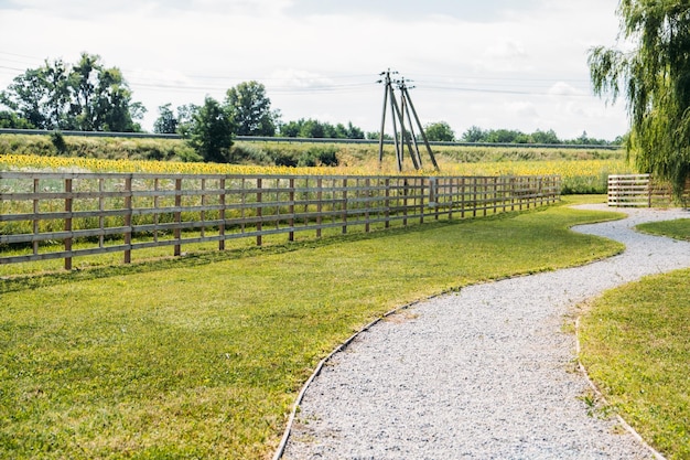 Beautiful day on the farm countryside landscape rural farm and wooden fence