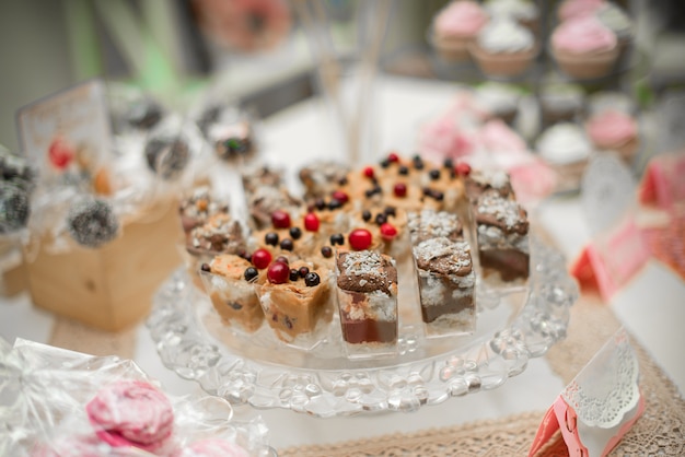 Beautiful and decorated candy bar close-up at a festive Banquet. Sweets close-up.