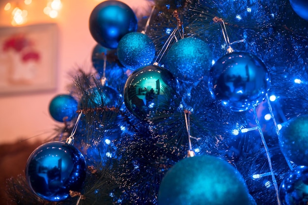 Beautiful decorated Christmas tree with blue lights xA