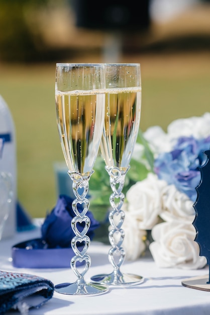 Beautiful decorated holiday glasses with champagne close-up.