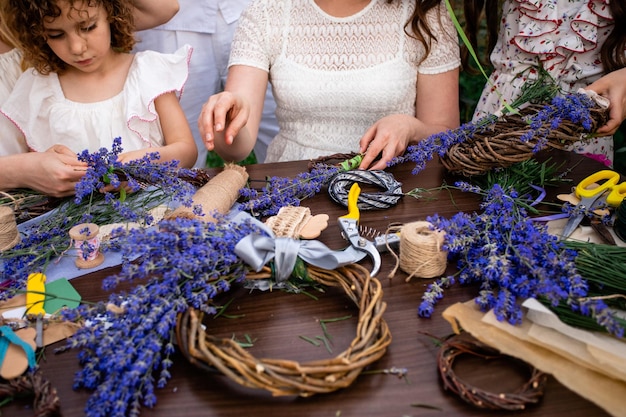 Beautiful decorated wooden wreath with blooming lavender