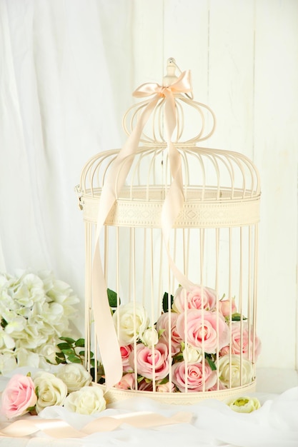 Beautiful decorative cage with beautiful flowers