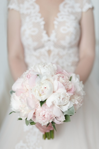 Beautiful and delicate wedding bouquet of peony roses 