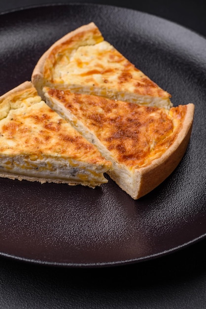 Beautiful delicious quiche pie with four types of cheese with spices and herbs