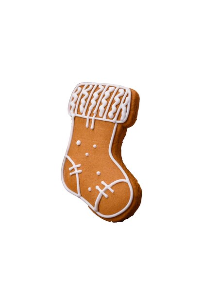 Beautiful delicious sweet winter Christmas gingerbread cookies on a bronze textured background