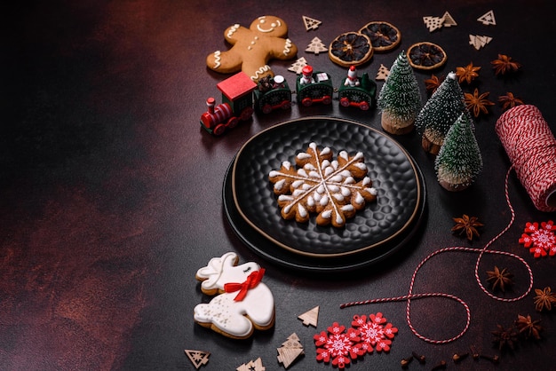 Beautiful different Christmas decorations and gingerbread on a brown concrete table