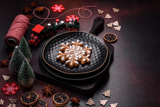 Beautiful different Christmas decorations and gingerbread on a brown concrete table