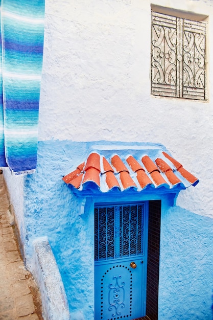 Beautiful diverse set of blue doors of the blue city of Chefchaouen in Morocco. Streets of the city are painted in blue in various shades. Fabulous blue town