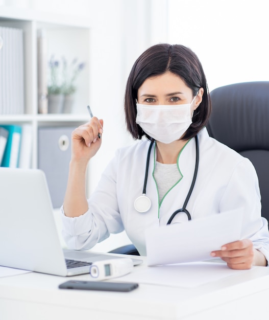 beautiful doctor in protective mask