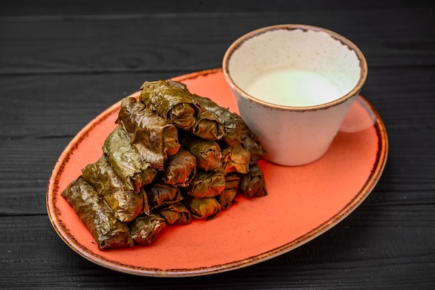 Beautiful dolma of grape leaves for dinner on the table