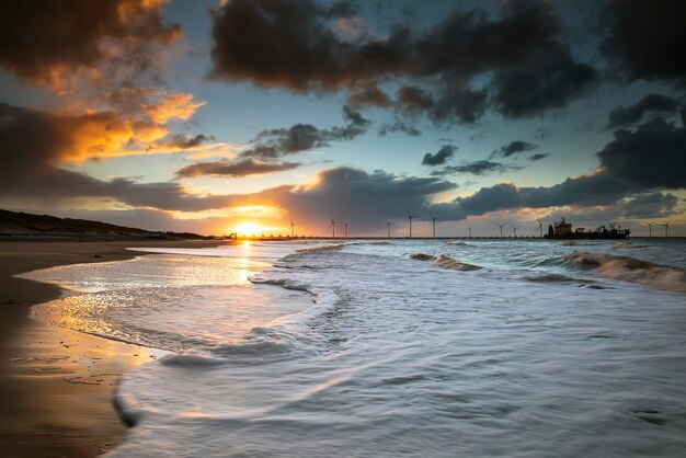 beautiful dramatic sunrise on north sea beach