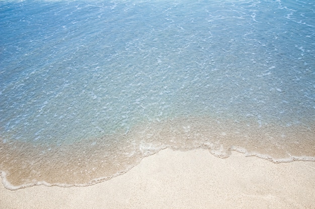 Beautiful drawing on the sand near the sea shore background