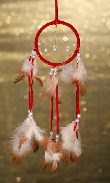 Beautiful dream catcher on background with lights