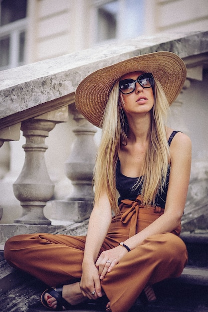 Beautiful elegant woman in hat outdoor