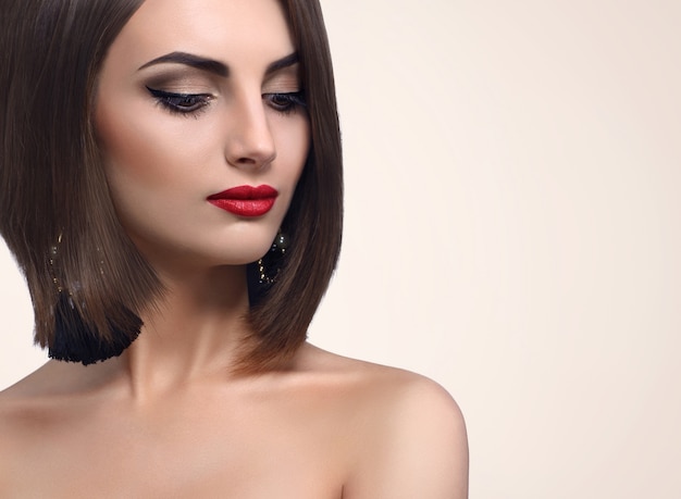 Beautiful elegant young woman posing in studio