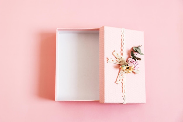 Beautiful empty open pink gift box isolated on pastel background Gift for holiday birthday Wedding Mothers Day Valentines day Womens Day Copy space Top view flat lay