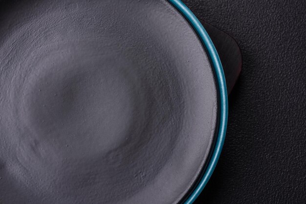 Beautiful empty round ceramic plate on a concrete background