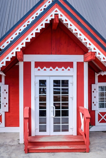 Beautiful entrance to a red wooden house