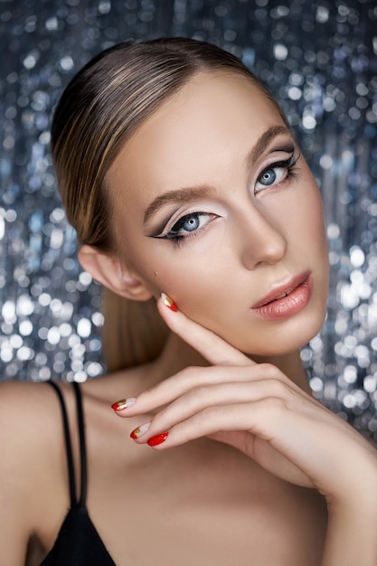 Beautiful evening eye makeup of a blonde woman