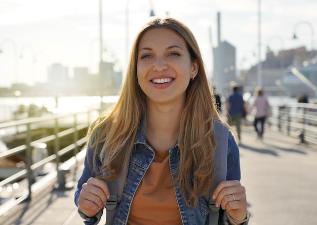 Beautiful excited school exchange girl visiting US city within the exchange program