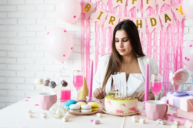 Beautiful excited woman celebrating birthday party