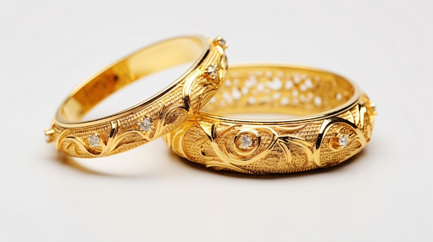 Beautiful expensive gold bracelets and ring on white background