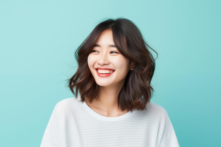Photo 외 평평한 배경에 있는 아름답고 표현력 있는 아시아 소녀