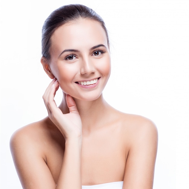 Beautiful face of young adult woman with clean fresh skin