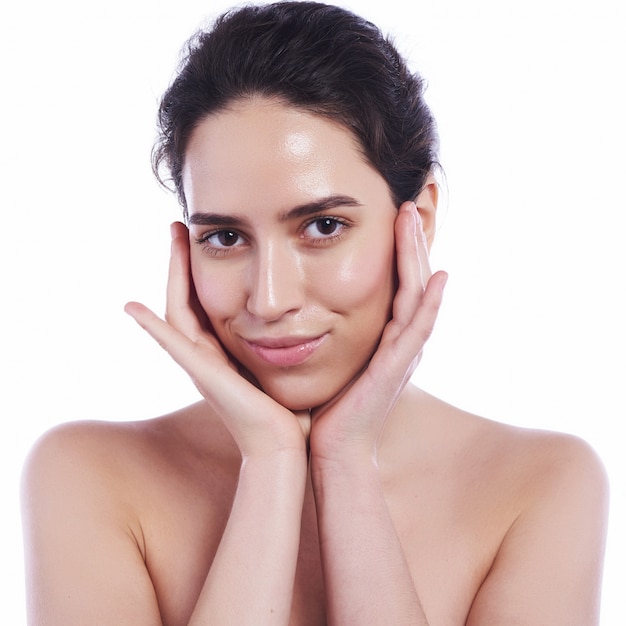 Beautiful face of young adult woman with clean fresh skin 