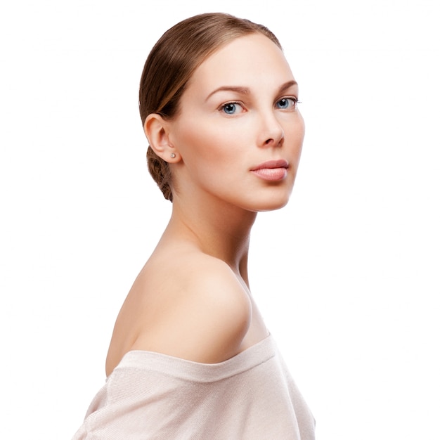 Beautiful face of young adult woman with clean fresh skin