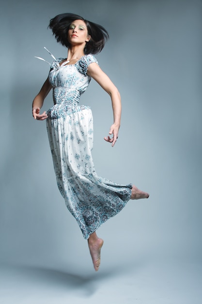 Beautiful fairy flying girl in blue  dress