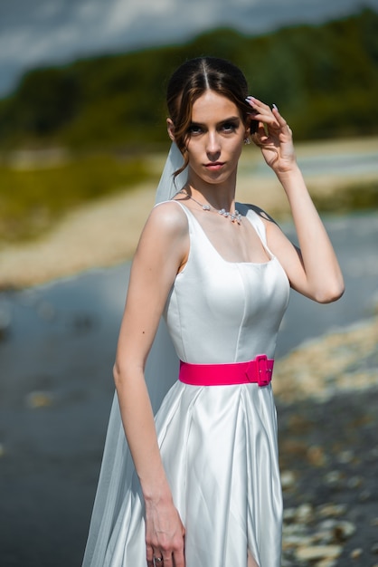 beautiful fashion bride on the wedding day outdoor on the river