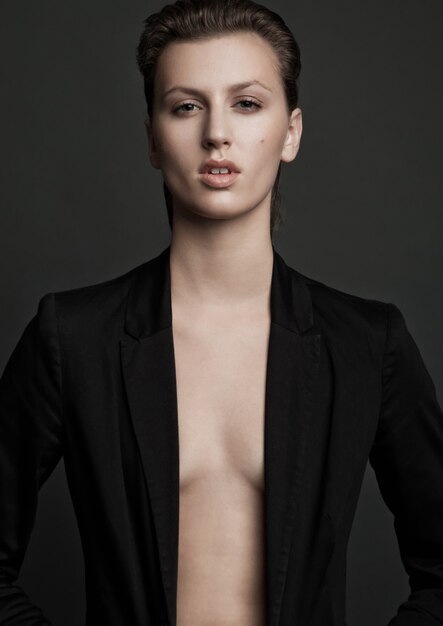 Beautiful fashion model wearing black suit