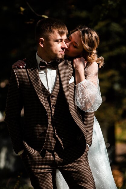 Beautiful fashion young bride and groom wedding day