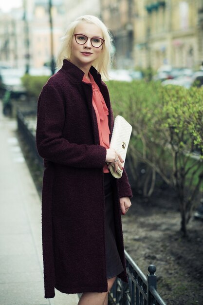 Beautiful fashionable woman on the city street. Summer day.