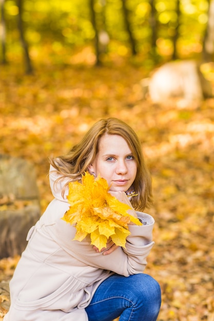 Beautiful female in the autumn park