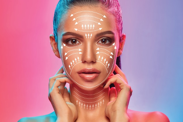 Beautiful female face isolated on gradient background. Neon. Concept of bodycare, cosmetics, skincare and lifting, correction surgery, beauty and perfect skin. Colorful flyer for your ad. Antiaging.