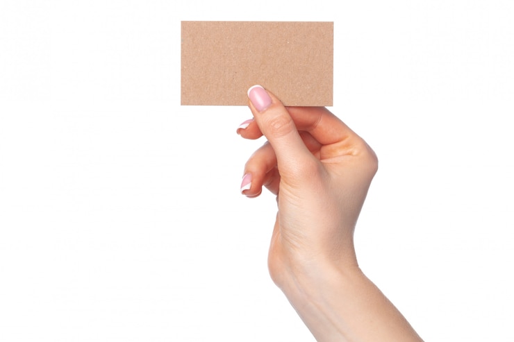 Photo beautiful female hand holding white business card on white