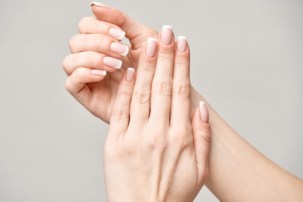 Beautiful Female Hands with French manicure