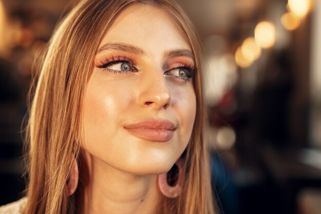 Beautiful female model portrait in a cafe