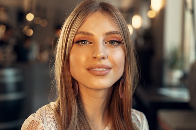 Beautiful female model portrait in a cafe